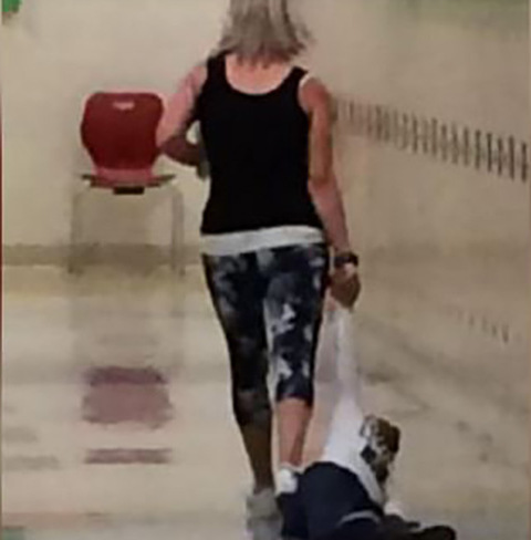 White Teacher Dragging Black Child